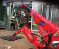 Kombi 7211-DSG and UNIC mini crane installing revolving doors