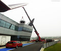 The URW-1006 mini crane lifting a car at Silverstone