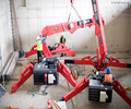 Two URW-506 mini spider cranes working in tandem